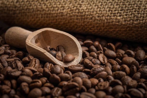 Jute sack, wooden spoon and coffee beans