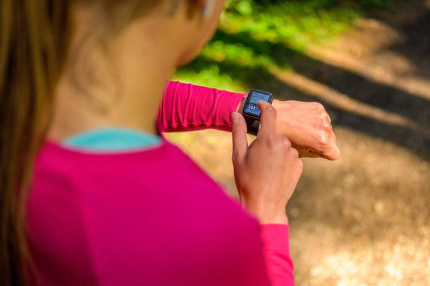 istock Young woman checking her smart watch 1301648975