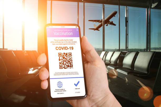 Immunity passport covid-19 vaccination travel mobile phone Immunity passport covid-19 vaccination travel mobile phone airplane ticket photos stock pictures, royalty-free photos & images