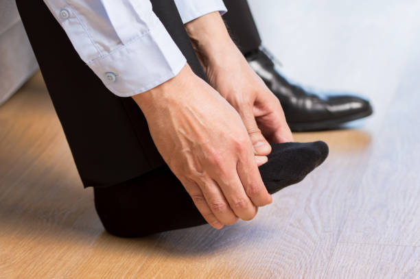 istock man suffering with foot pain 1301650434