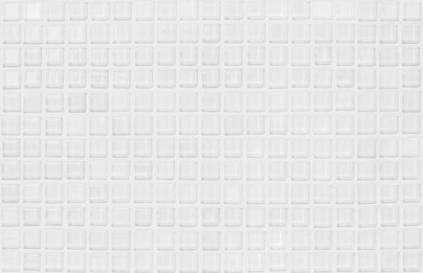 istock White or gray ceramic wall and floor tiles abstract background. Design geometric mosaic texture decoration of the bedroom. Simple seamless pattern for backdrop hospital wall, canteen and grid paper. 1301658678