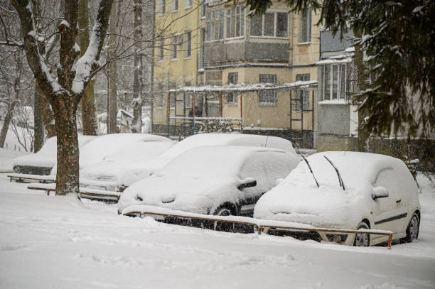 istock Snow covered cars stuck at parking 1301659065