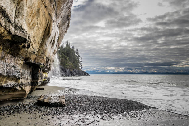 rocky cliff and waterfalls at Mystic Beach at Juan De Fuca Provincial Park, British Columbia, Canada