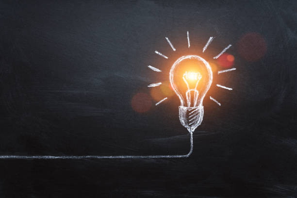 istock idea concept with innovation and inspiration, style symbol of creativity, brainstorm, creative idea, thinking. Lightbulb drawed by chalk representing ideas on dark background 1301661417