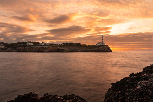 Landscape with the Portocolom lighthouse in Majorca, at sunrise stock photo
