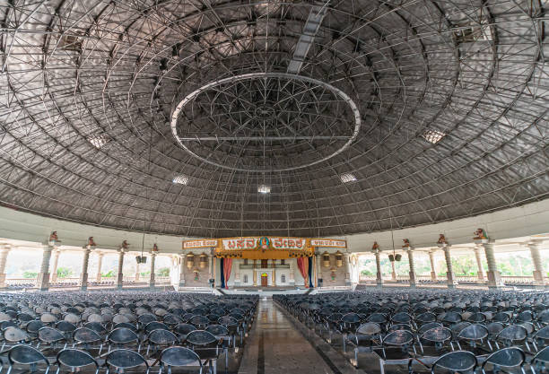 Chowdakamaladinni, Karnataka, India - November 8, 2013: Large hall with stage and seating under circular celiing at Basava Mantapa.