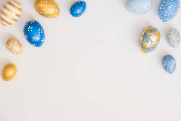 istock Frame of Easter decorated eggs isolated on white background. Minimal easter concept. Happy Easter card with copy space for text. Top view, flatlay 1301670329