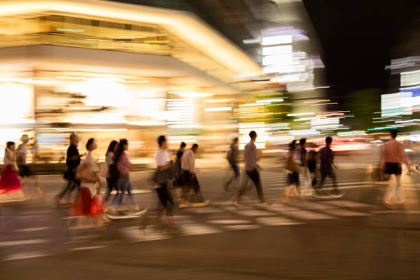 istock Commuters crossing the street at dusk 1301678153