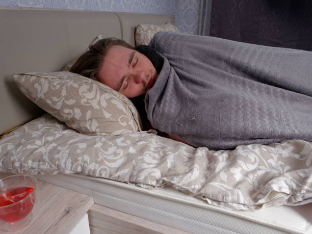 istock young guy sleeping in bed in the bedroom after taking cold medicine 1301678307