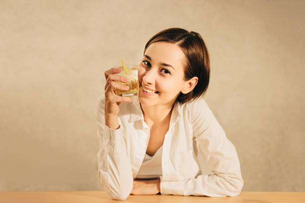 istock woman holding a highball (whiskey) 1301678501