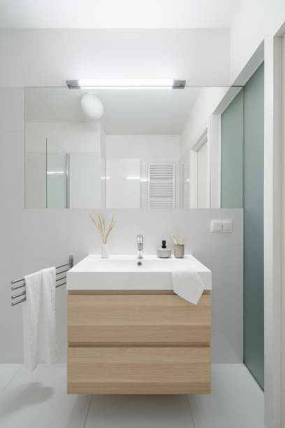 istock Simple washbasin with wooden cabinet 1301683462