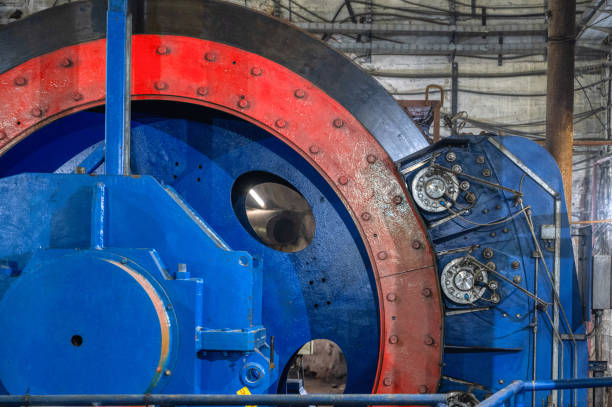 istock Huge shaft elevator machine. Modern equipment for lifting and lowering the cage shaft 1301687823