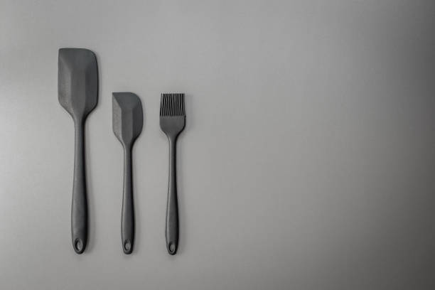 Kitchen utensils cooking or bakery set on black background. Top view