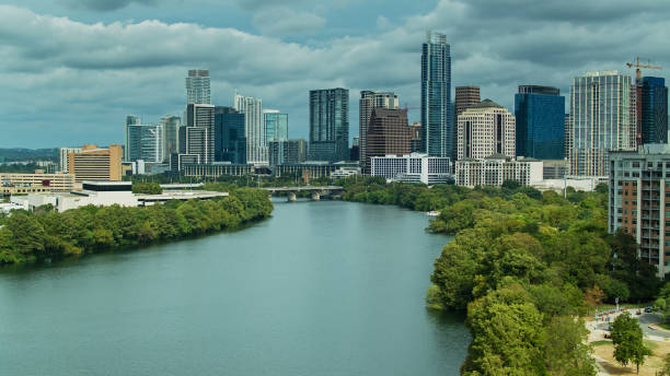 istock Austin, Texas Skyline Rising Over Colorado River - Drone Shot 1301693512