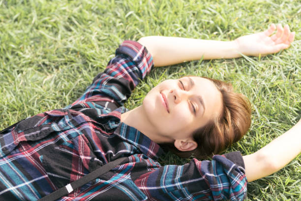 istock Woman relaxing in the park 1301693557