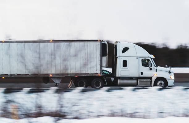 istock Semi-Truck at Highway Speed 1301694294