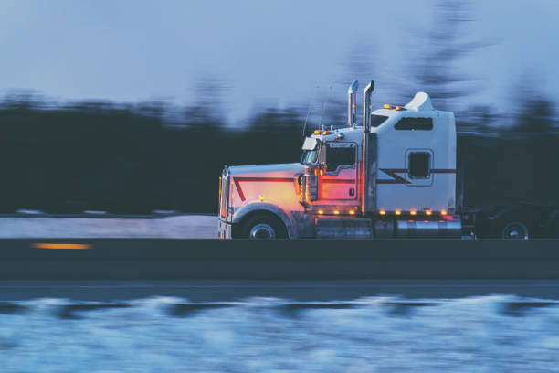 istock Semi-Truck at Highway Speed 1301694297