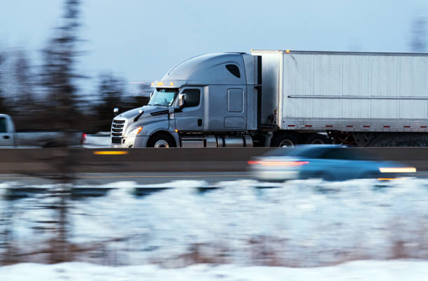 istock Semi-Truck at Highway Speed 1301694298