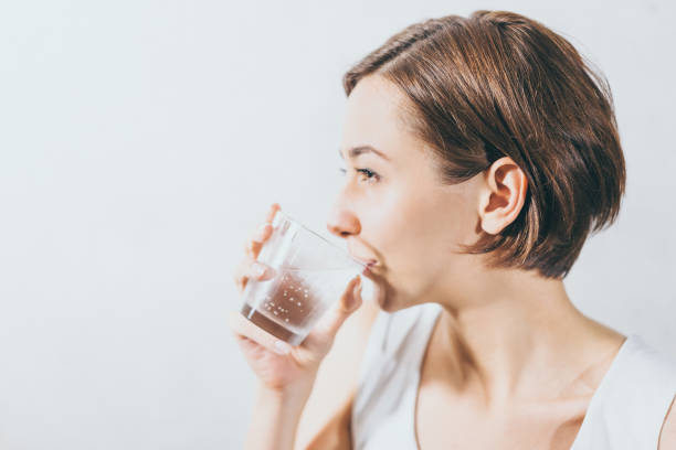 Young woman holding water