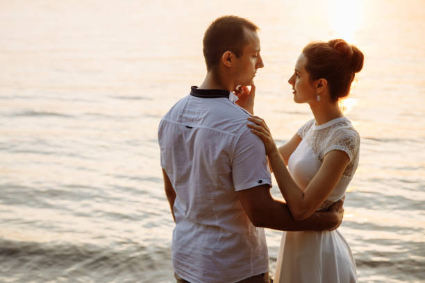 istock Young beautiful woman stroking the mans compilations. 1301695447