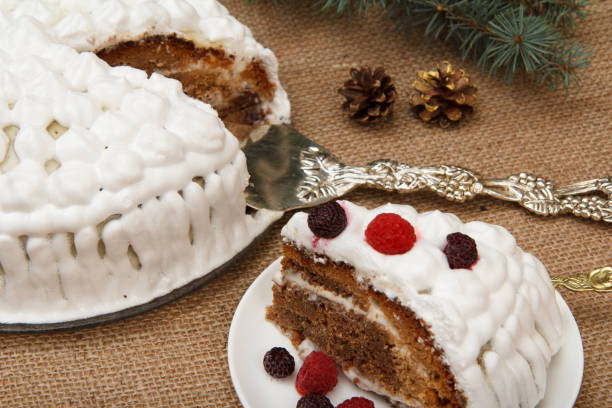istock Sliced biscuit cake decorated with whipped cream and raspberries 1301709571
