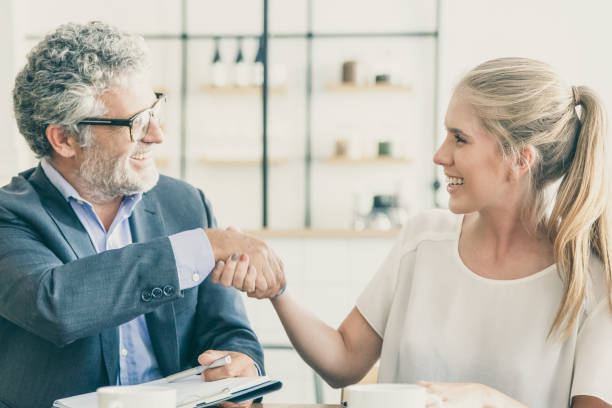 istock Mature expert meeting with young customer 1301711651