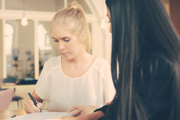 istock Female agent and customer meeting at co-working 1301712867