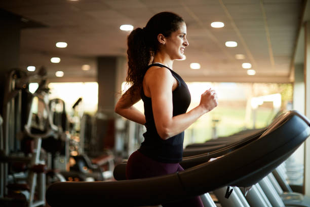 istock Fit woman running on the treadmill 1301715017