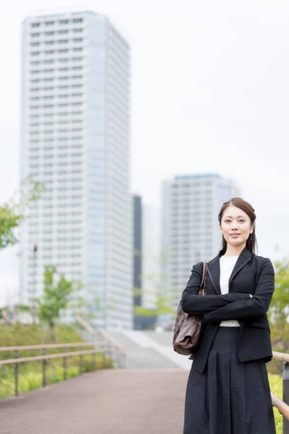 istock Woman with arms folded (business image) 1301715680