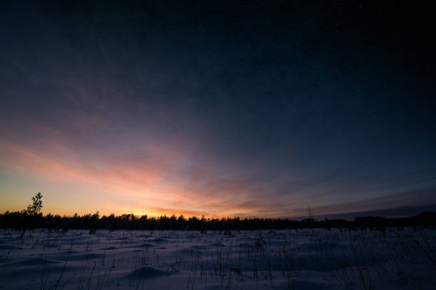 istock Epic sunset in winter with stars on the sky 1301716829