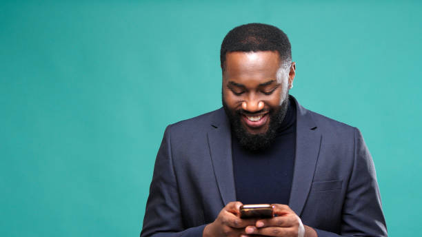 istock Gentleman holds smartphone in hands and writes text message 1301718292