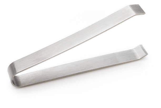 istock Metal tweezers to remove bones from fish. Isolated on white background. 1301720488