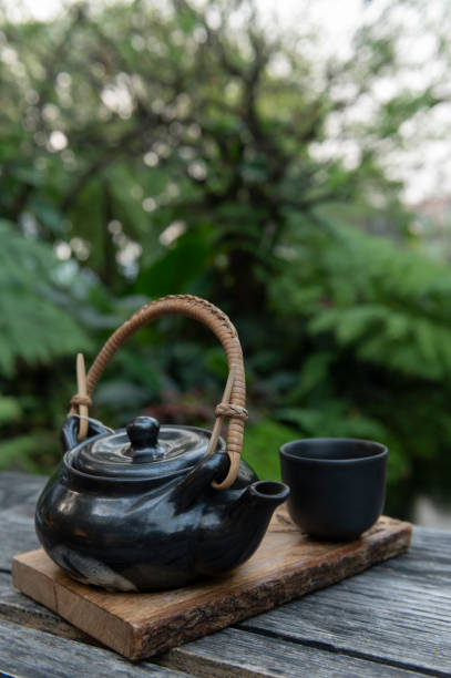 istock Black Japanese tea cup on wooden background, 1301720822