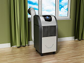 Generic portable air conditioner standing near the window in the room