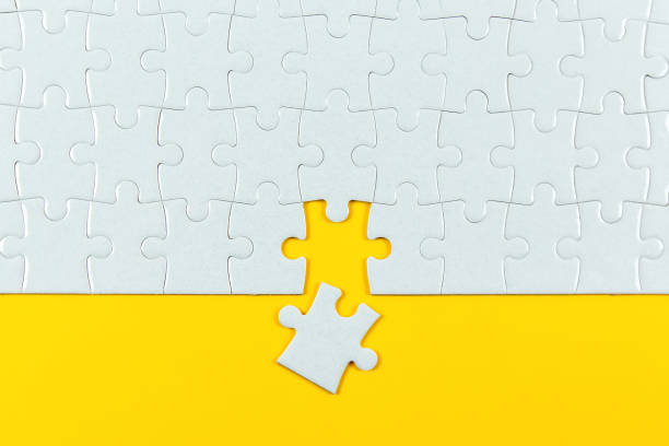 istock Jigsaw Puzzle on Yellow Background 1301723584