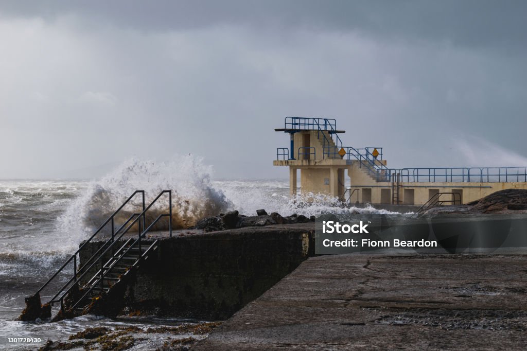 Galway Blackrock diving boards during stormy weather Rough seas during a powerful Atlantic ocean storm Ireland Stock Photo