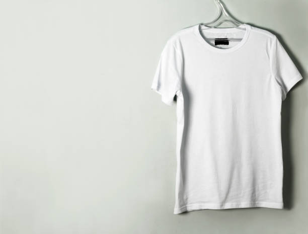 istock An empty T-shirt hangs on the wall with a copy of the space 1301728502