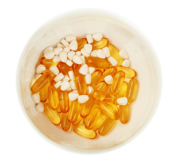 istock White bowl with fish oil capsules 1301729501