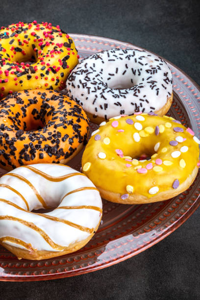 istock donuts with different flavors of frosting on a platter 1301730473