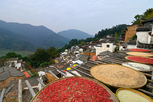 Huangling is an ancient mountain village in traditional Huizhou-style architecture located in Wuyuan County, Jiangxi Province, China. Every autumn, all families dry chili pepper and other crops outside of their houses, offering an authentic Chinese countryside travel experience.