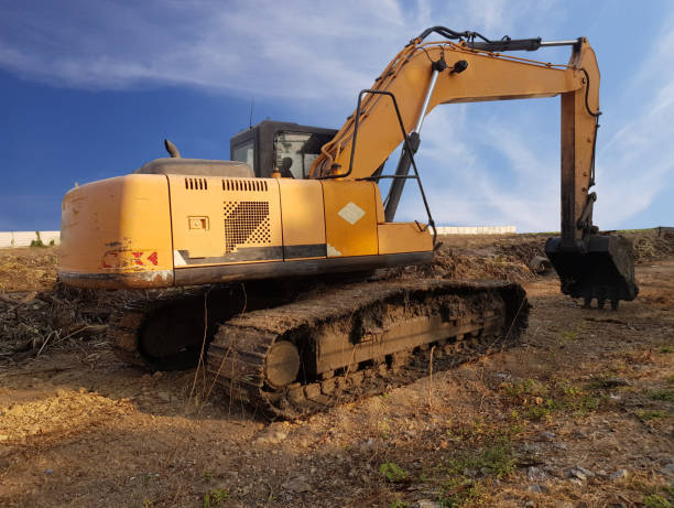 istock Backhoe to adjust the soil to prepare the construction. 1301731710