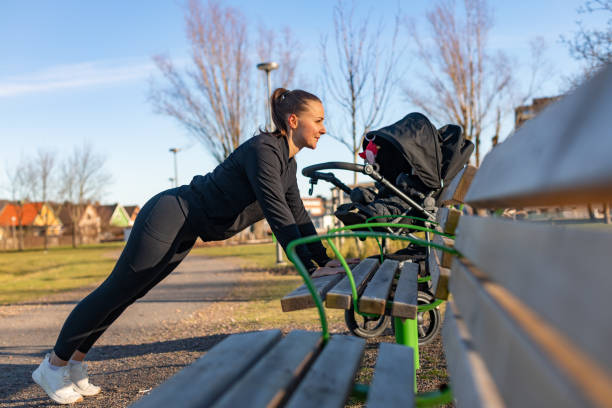 istock Mother exercising with her baby 1301733250