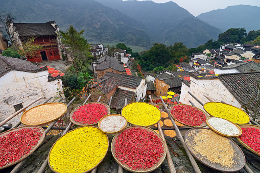 Huangling is an ancient mountain village in traditional Huizhou-style architecture located in Wuyuan County, Jiangxi Province, China. Every autumn, all families dry chili pepper and other crops outside of their houses, offering an authentic Chinese countryside travel experience.
