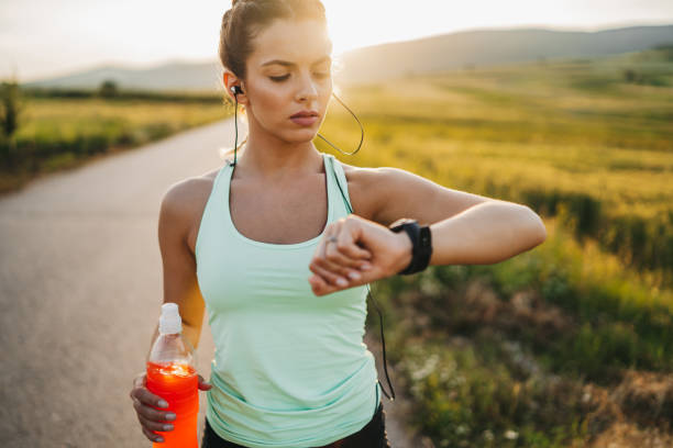 istock Running female with mobile phone connected to smart watch 1301736985