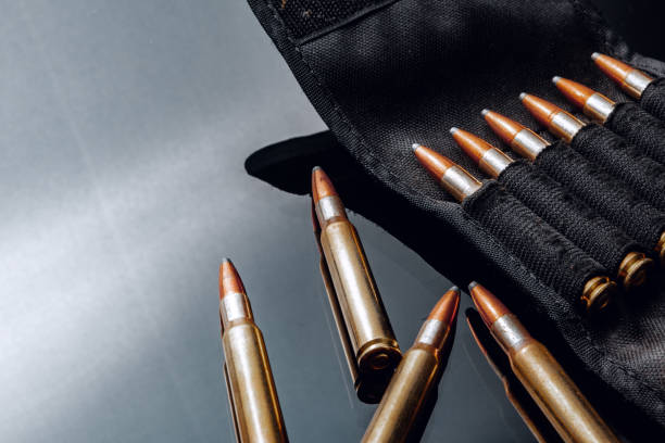 istock Rifle bullets or cartridges on black shiny background 1301737052