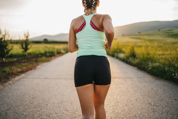 istock Young woman running in nature 1301738082