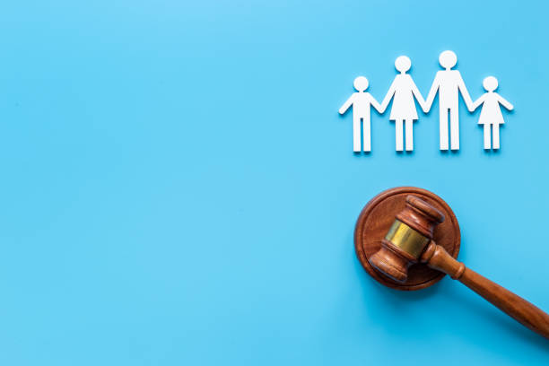 Family law or divorce concept. Family figure with judge gavel, top view stock photo