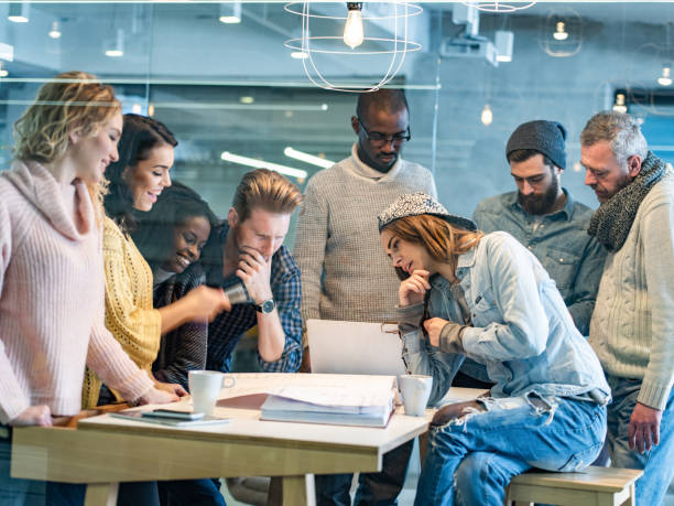 istock Team of building contractors analyzing blueprints on a meeting in the office. 1301738501