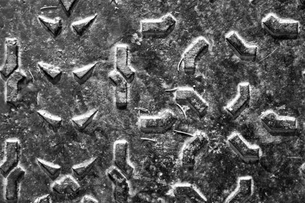 istock black and white texture of metal plate with irregular embossed patterns 1301739252