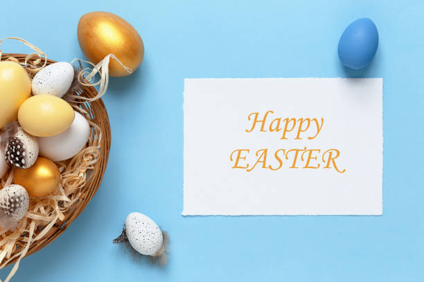 istock Easter background with colorful eggs in a basket on a blue background. Top view with copy space, mock up 1301742225